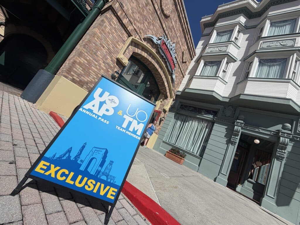 UOAP and Team Member exclusive sign outside Custom Gear at Universal Studios Florida