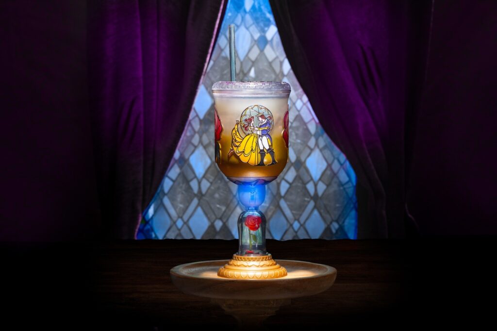 The new light-up Be Our Guest Goblet featuring Belle and the Beast in stained glass