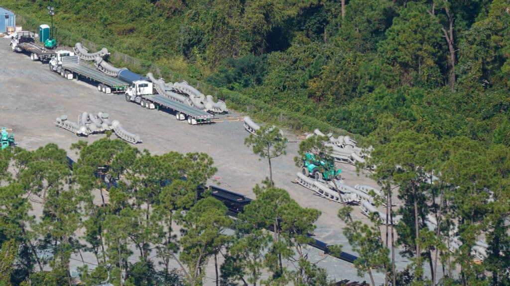 Flying Door coaster track sections staged on flatbed trucks