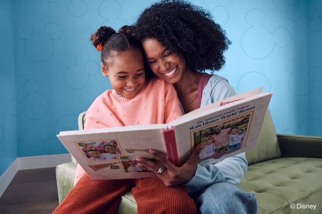 A family looking through a personalized Shutterfly photo book